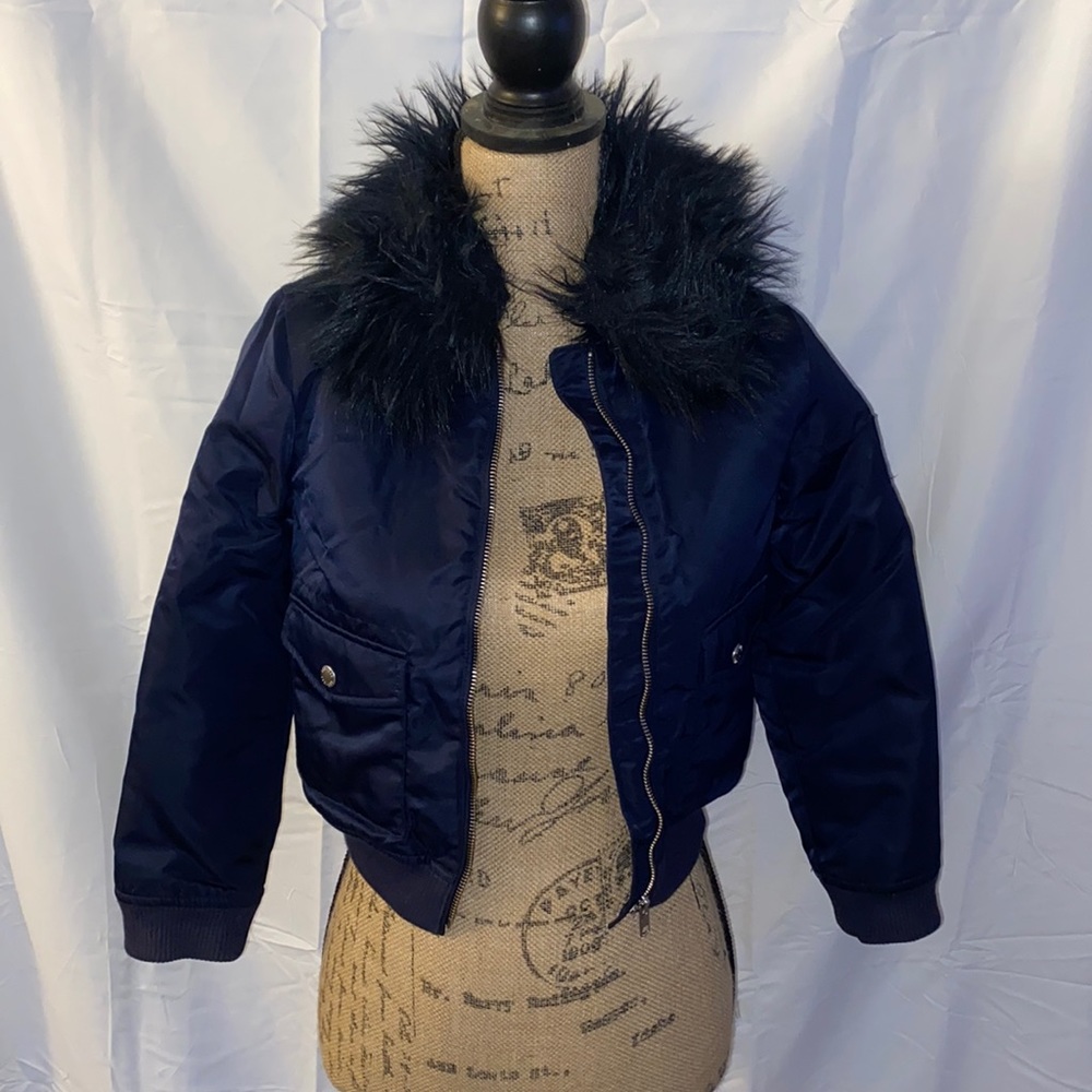 Coat with fur trim on around neck